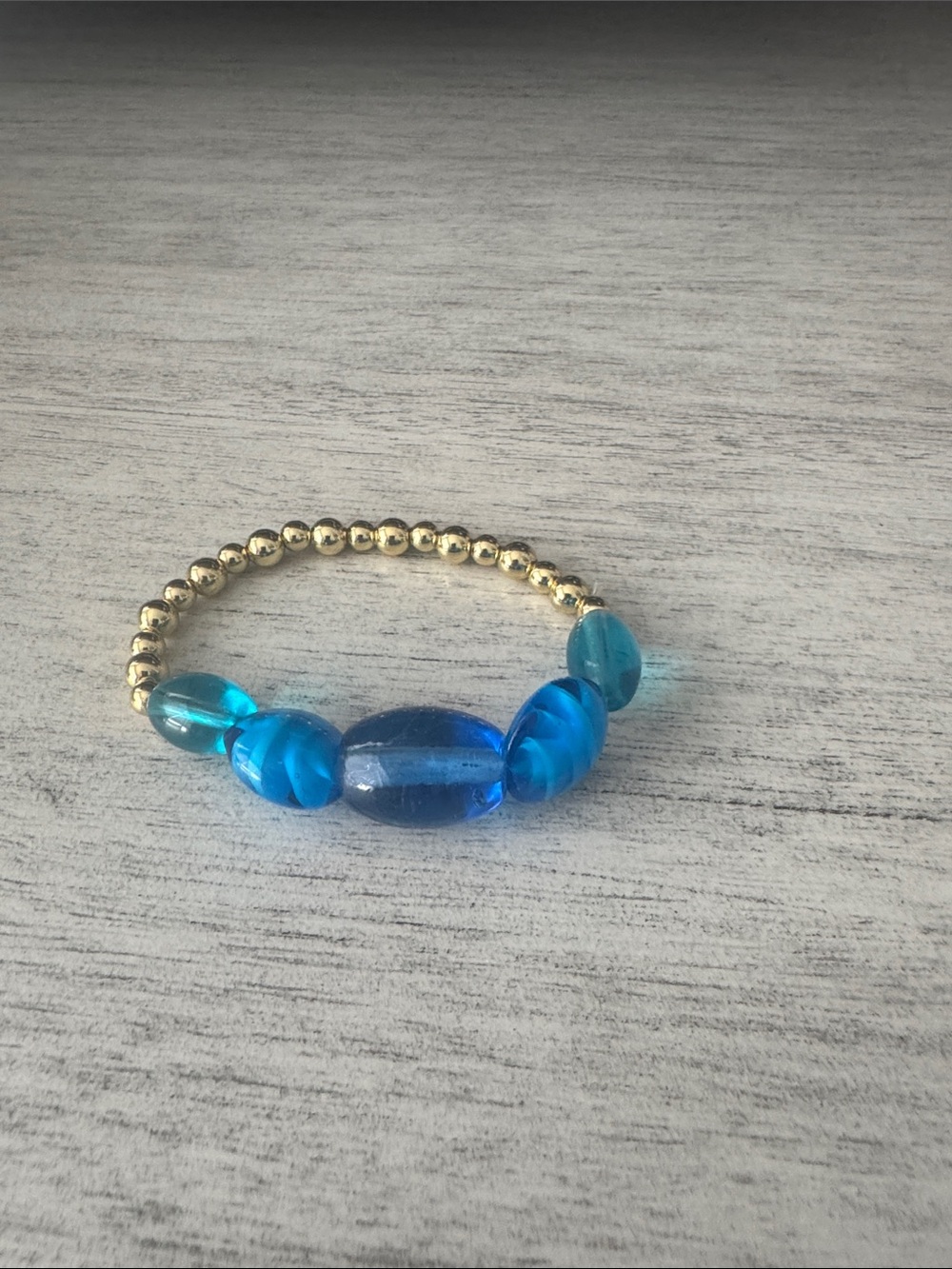 Gold-Tone Stretch Bracelet with Bright Blue Glass Beads